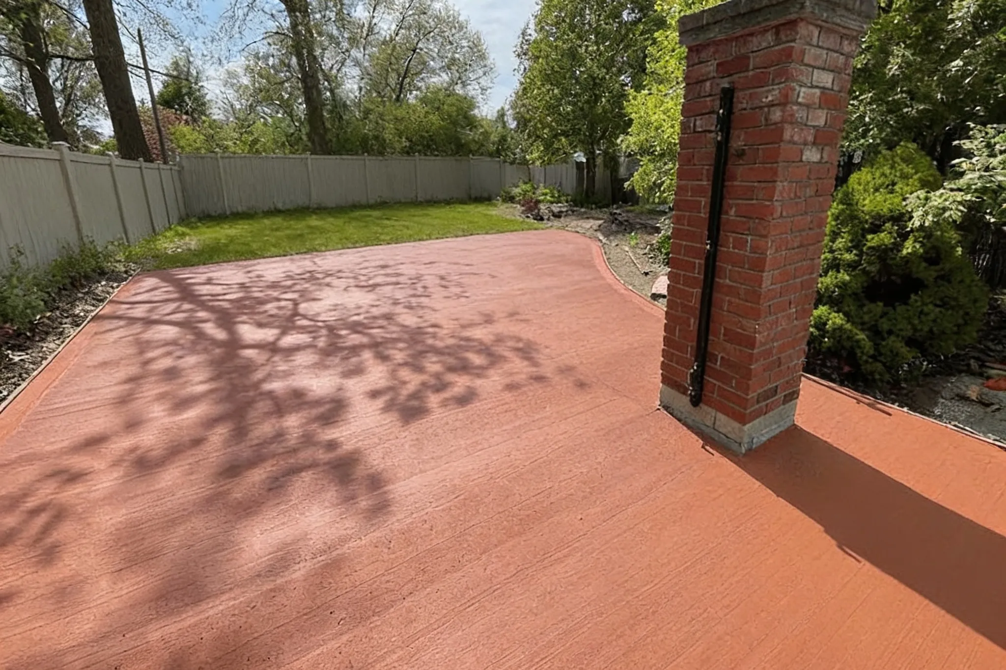 A finished backyard concrete patio, Southern Ontario
