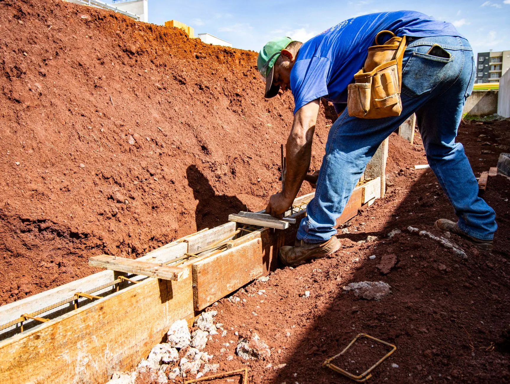 Concrete being placed into wooden driveway forms (stock placeholder photo)