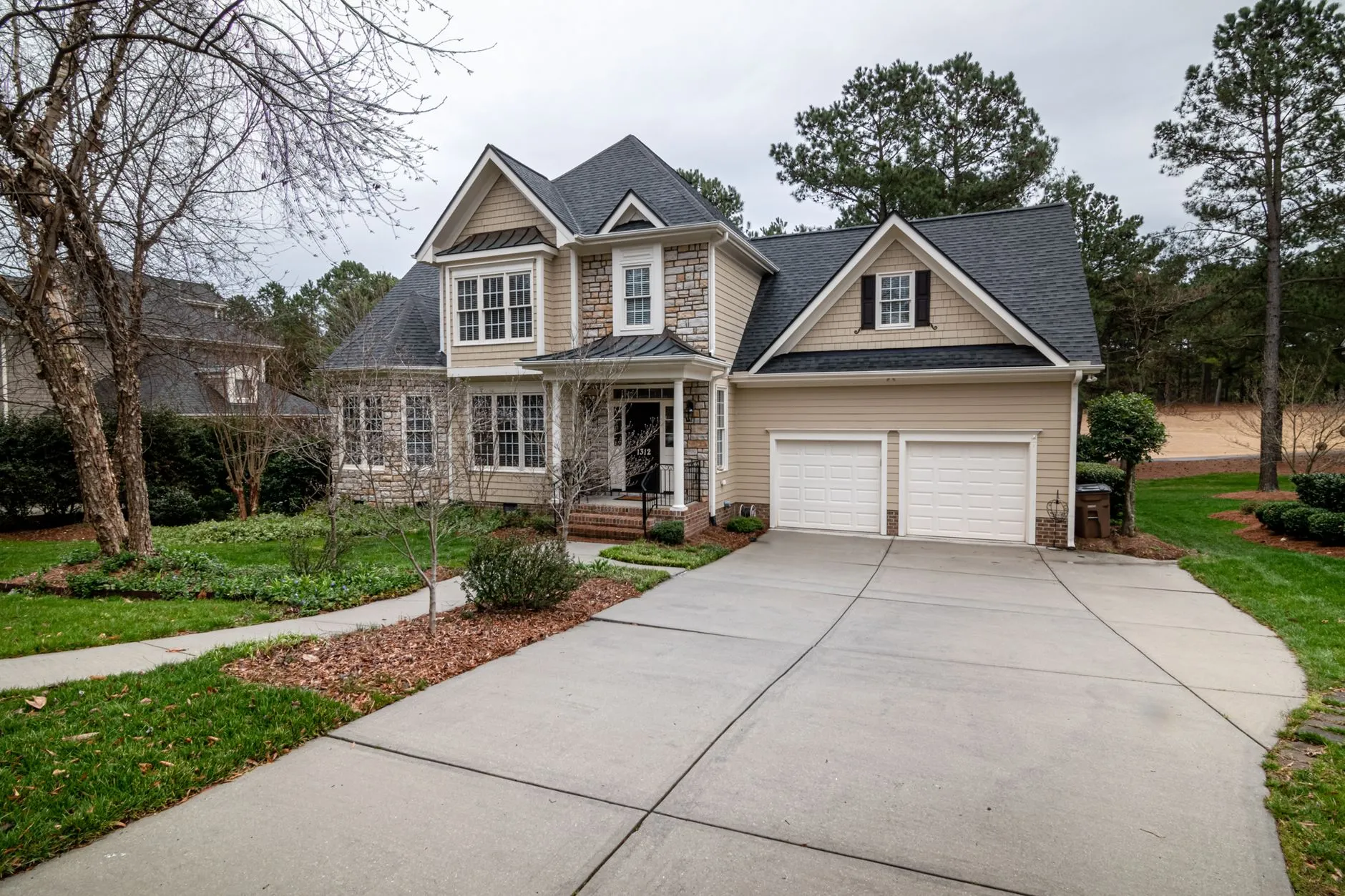 Finished concrete driveway at a residential home (stock placeholder photo)
