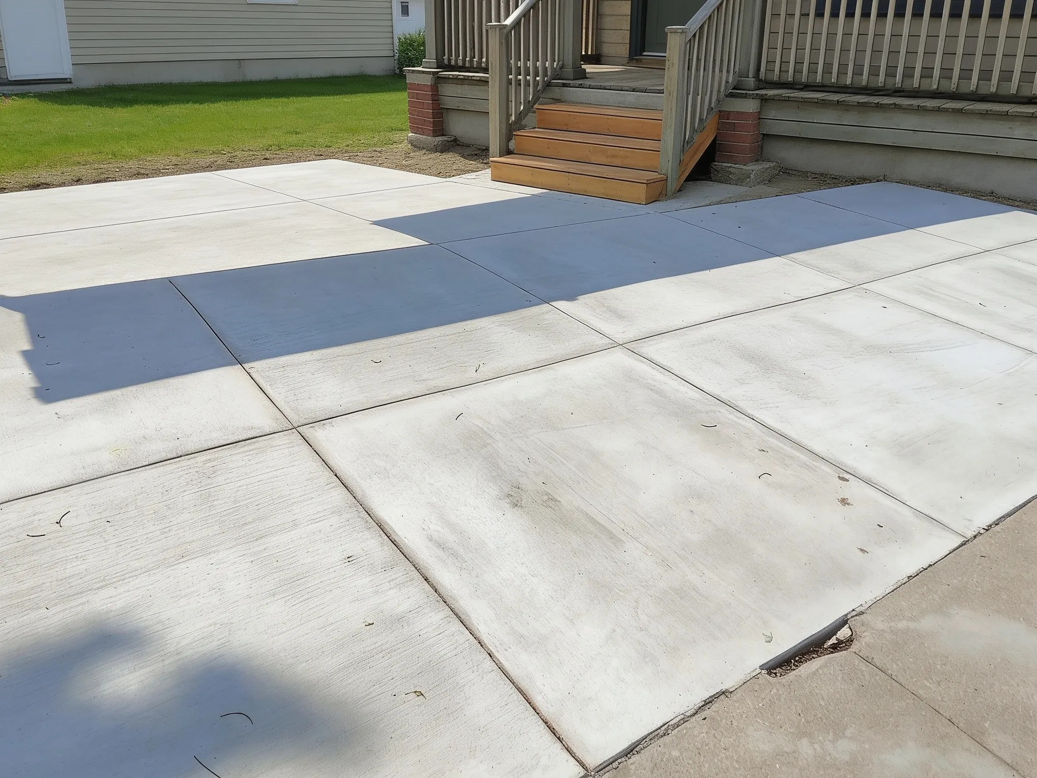A finished, cured concrete patio and steps at a Southern Ontario home